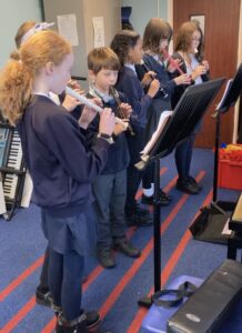 Children playing recorders