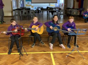 Children playing guitars
