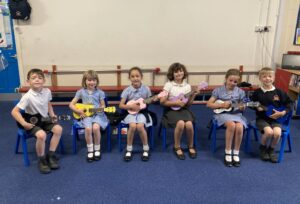 Children playing ukeleles